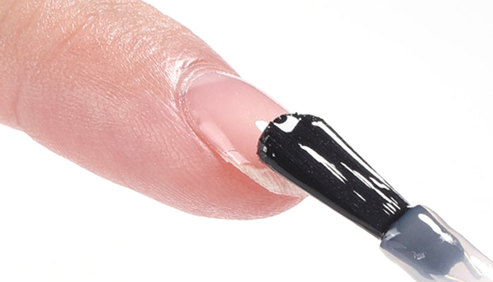 Applying gel nail base coat for nail prep and long-lasting manicure foundation