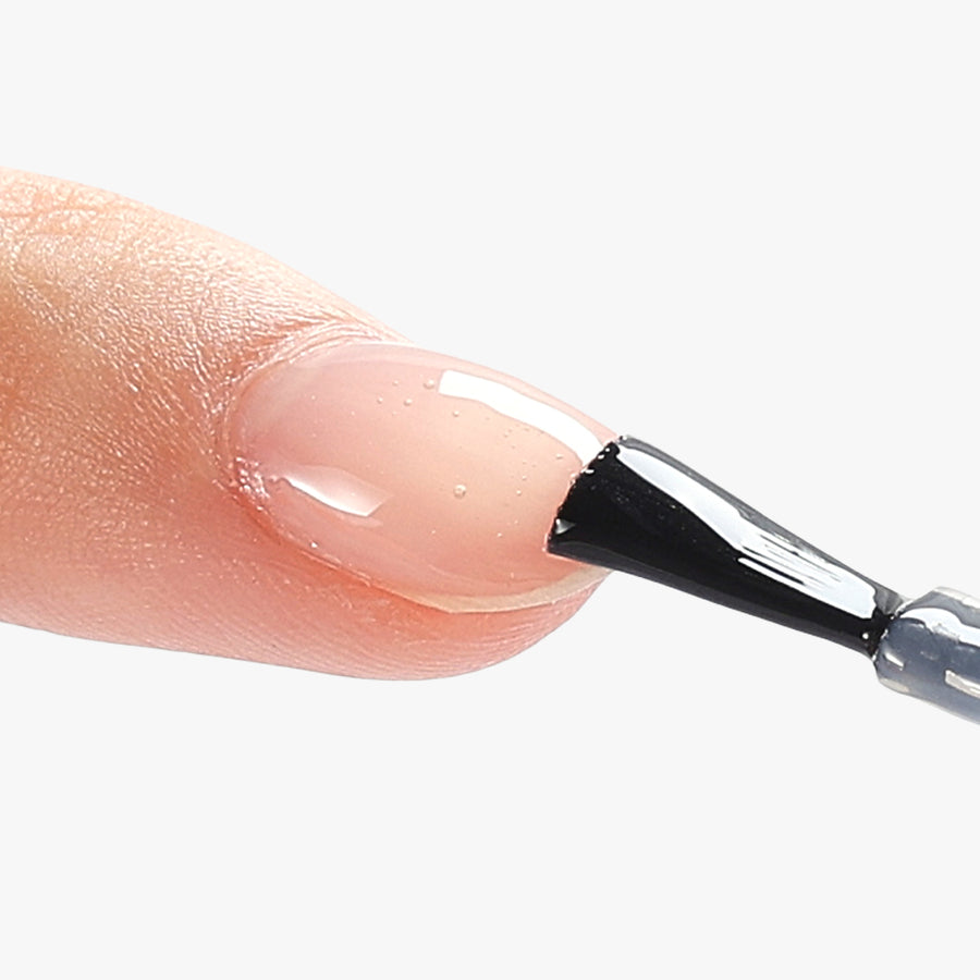 Applying-top-gel-after-filing-the-cured-builder-gel-on-nail-surface